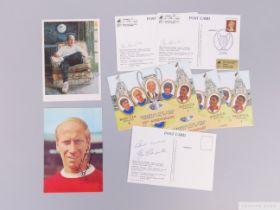 An autographed Bobby Charlton postcard