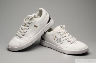 Roger Federer a pair of white tennis shoes autographed by Roger Federer at the 2022 Laver Cup