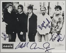 A black and white Creation Records Oasis promotional photographic print signed by all five original