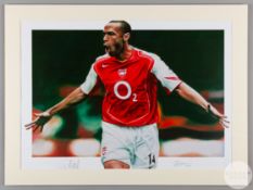 A large colour image of Thierry Henry in an Arsenal home kit