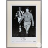 A large black and white photographic print of John Charles and Ferenc Puskas leaving the pitch aft