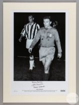 A large black and white photographic print of John Charles and Ferenc Puskas leaving the pitch aft