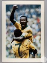 A large colour photographic print of Pele celebrating scoring Brazil's 100th World Cup Goal