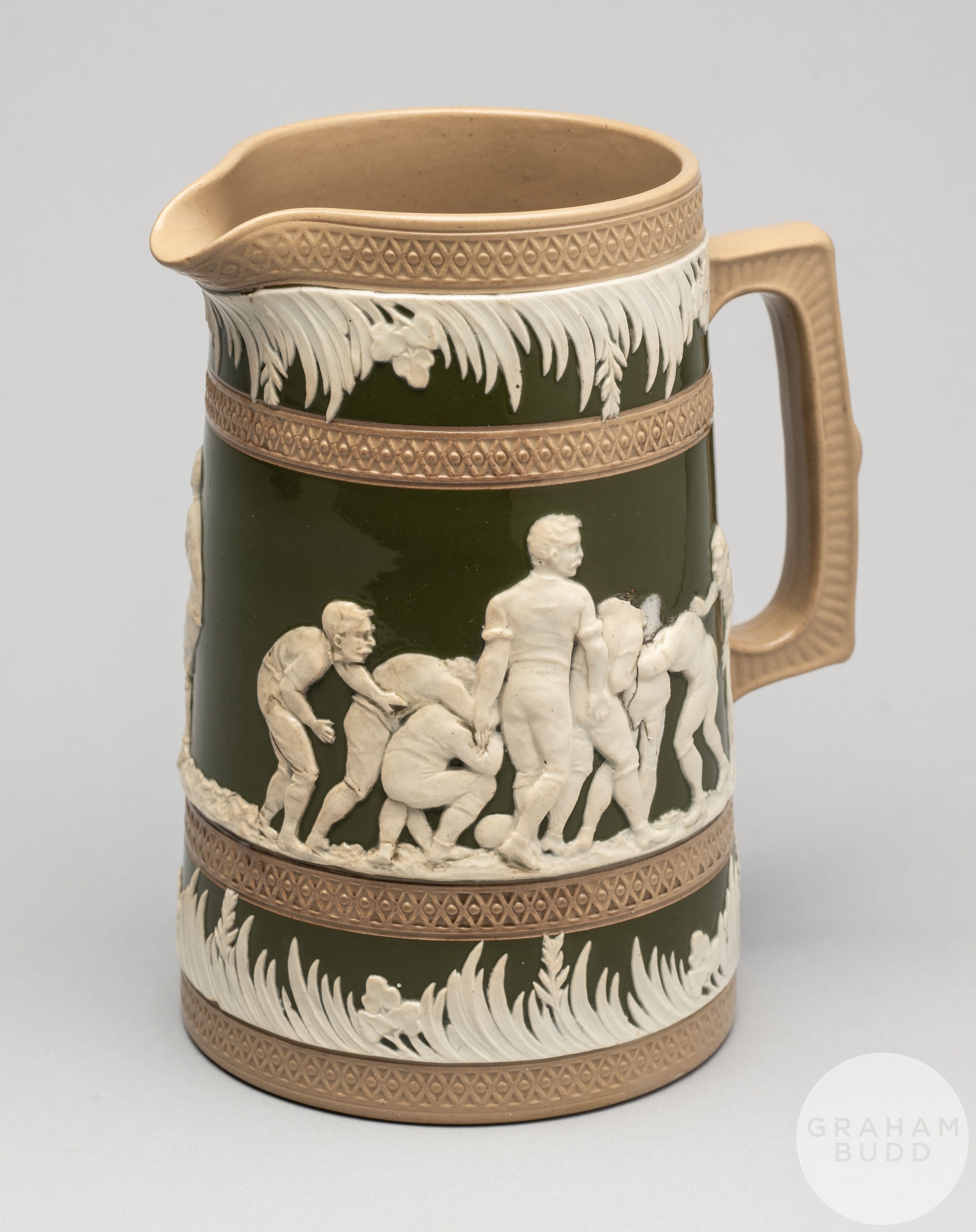 A large Copeland late Spode stoneware jug, decorated with rugby scenes