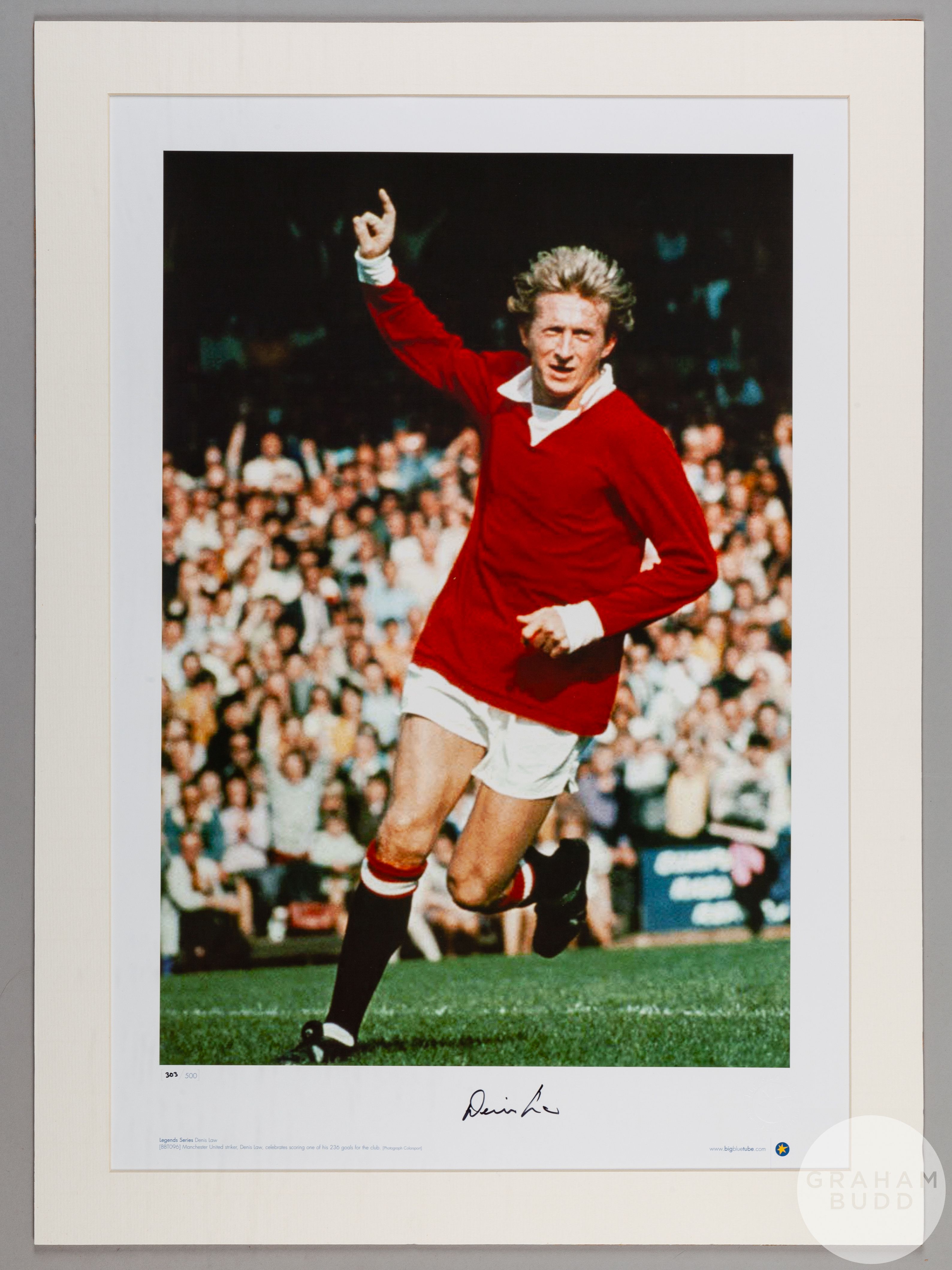 A large colour photographic print of Denis Law playing for Manchester United.