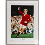 A large colour photographic print of Denis Law playing for Manchester United.