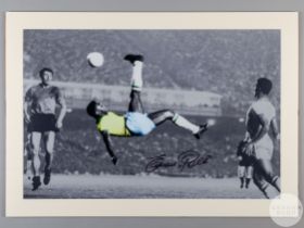 A large black and white/colour photographic print of Pele