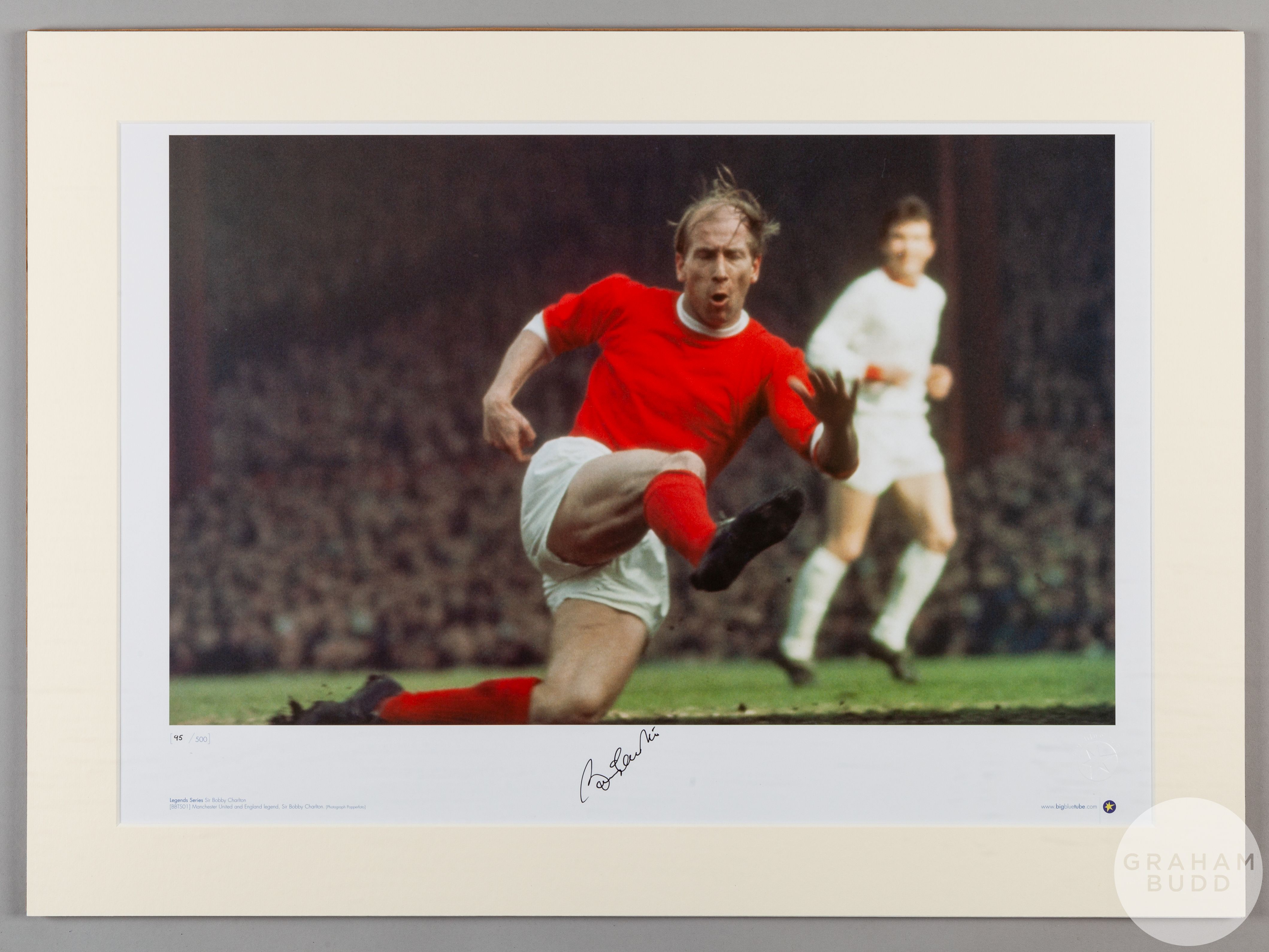 A large colour photographic print of Sir Bobby Charlton playing for Manchester United