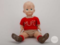 Plastic boy doll with MUFC knitted jersey and shorts, late 1950’s/early 1960’s.
