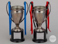 Two miniature Champions League trophies, both 6.5in. high on bakelite base.