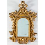 Specchiera in legno intagliato e dorato, Emilia, fine del XVII - inizi del XVIII secolo. Cornice