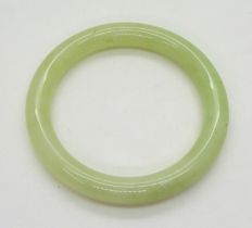 A Chinese green hardstone bangle, inner diameter 6.5cm Condition Report:Available upon request