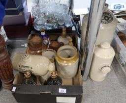 A collection of stoneware jugs, decanters and flagons including two Doulton jugs, stone pigs etc