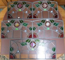 A lot of five early 20th century leaded stained glass panels, largest, 36cm x 81cm next two 36cm x