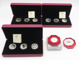 Three Royal Canadian Mint Forgotten 1927 Designs silver three-coin sets, together with a Monetary