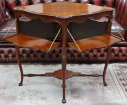 A 20th century mahogany diamond shaped window table with drop sides on cabriole supports joined by