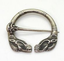 A silver Alexander Ritchie pen annular brooch with Ram's head finials, diameter 4.7cm, stamped A.