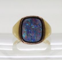 A 9ct gold gents signet ring set with an opal doublet on onyx, finger size R, weight 9gms
