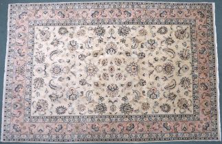 A CREAM GROUND FINE KASHAN RUG  with all-over floral patterned ground and light pink flower head