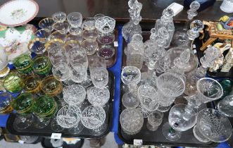 A collection of gilt rimmed drinking glasses, etched glasses, others and assorted decanters etc