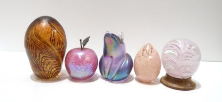 A John Ditchfield Glasform frog in lilac iridescent glass, and an apple paperweight with silver stem