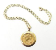 A 1913 full gold sovereign in a 9ct gold pendant mount with a 44cm long long link curb chain, weight
