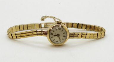 A 9ct gold ladies Tissot watch with integral strap, diameter of the case 16.8mm,  weight 16gms