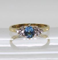 A 9ct gold topaz and diamond accent ring, finger size J1/2, weight 1.8gms Condition Report:Available