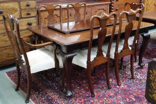 An early 20th century mahogany wind out dining table on cabriole supports, 75cm high x 166cm long (