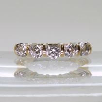 An 18ct gold five stone diamond ring, set with estimated approx 1.10cts of brilliant cut diamonds.