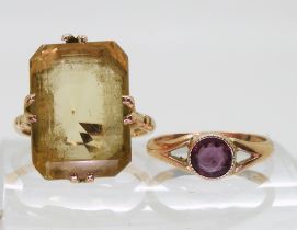 A 9ct gold large citrine ring, citrine approx 18mm x 13mm, finger size P1/2, and a 9ct purple gem
