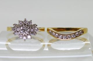 A diamond cluster ring set with estimated approx 0.40cts of brilliant and baguette cut diamonds,