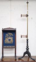 A Victorian brass wool winder on ebonised tripod base, 54cm high and a tapestry fire screen (2)