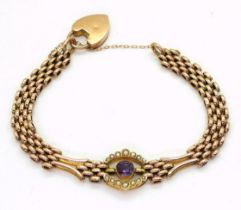 A 9ct gold amethyst and pearl fancy link bracelet with a heart shaped clasp, length 19.5cm, weight
