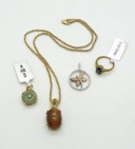 An 18ct gold clear gem set butterfly pendant, weight 3.2gms, a 9ct gold mounted golden rutilated
