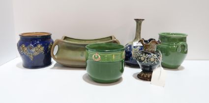 Two Doulton stoneware vases and a pot, a Fajans Sweden green glazed pot, an Eichwald pot and a