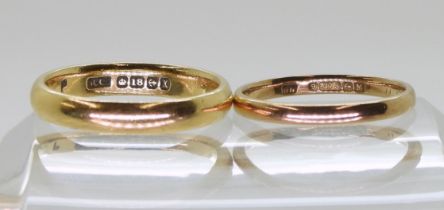 An 18ct gold wedding ring size O1/2, weight 4.5gms and a 9ct gold wedding ring size M1/2 weight 1.