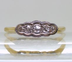An 18ct gold and platinum five stone diamond ring, inscribed 1954. Set with estimated approx .