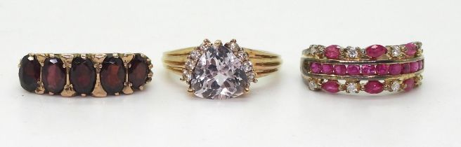 Three 9ct gold rings, garnet size M, a trilliant cut pale pink kunzite and clear gem ring size O1/2,