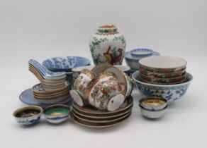 A collection of Chinese blue and white rice bowls and spoons, famille rose examples, Japanese egg