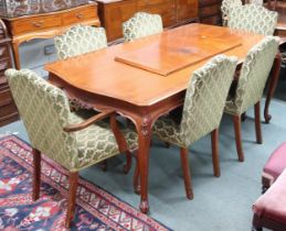 A 20th century reproduction dining suite consisting extending dining table, 77cm high x 182cm