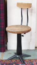 An early 20th century cast iron Singer machine operators chair with laminated back rest over