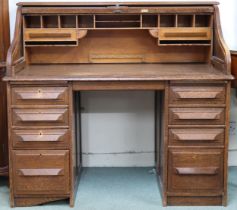 An early 20th century "Johnson & Appleyards Sheffield" oak tambour top desk with fitted interior