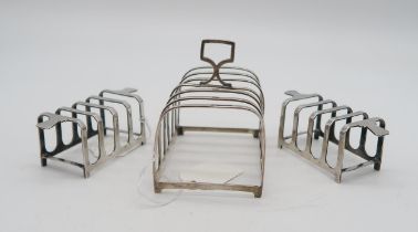 A pair of Art Deco silver four vision toast racks, by Mappin & Webb, Sheffield 1937, and a larger