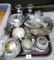 A collection of EPNS including candlesticks, tea sets, a cream and sugar cruet, casters etc