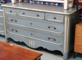A 20th century pastel blue and cream painted Grange provincial directoire design bank of drawers
