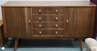 A mid 20th century Macassar veneered Morris of Glasgow sideboard with three central drawers