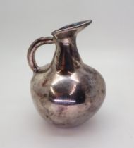 A silver jug, modelled after a Cycladic pottery example, 11.5cm high, 115gms Condition Report: