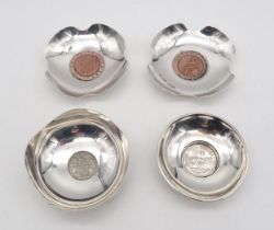 A pair of late-Victorian 'Cartwheel Penny' silver coin dishes, by Andrew Barrett & Sons, London