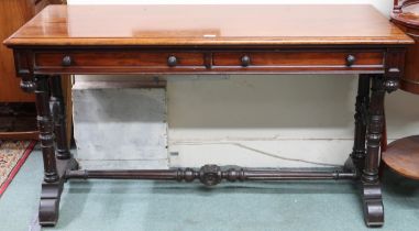 A Victorian mahogany two drawer hall table on turned supports with sledge feet joined by turned